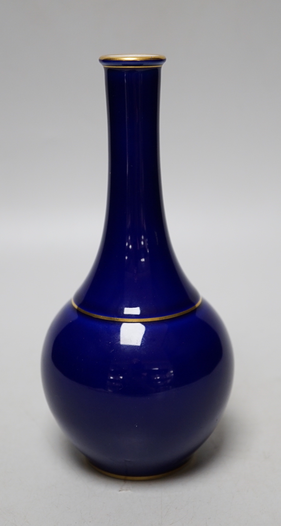 A Sevres blue glazed bottle vase, date code for 1924, 17cm